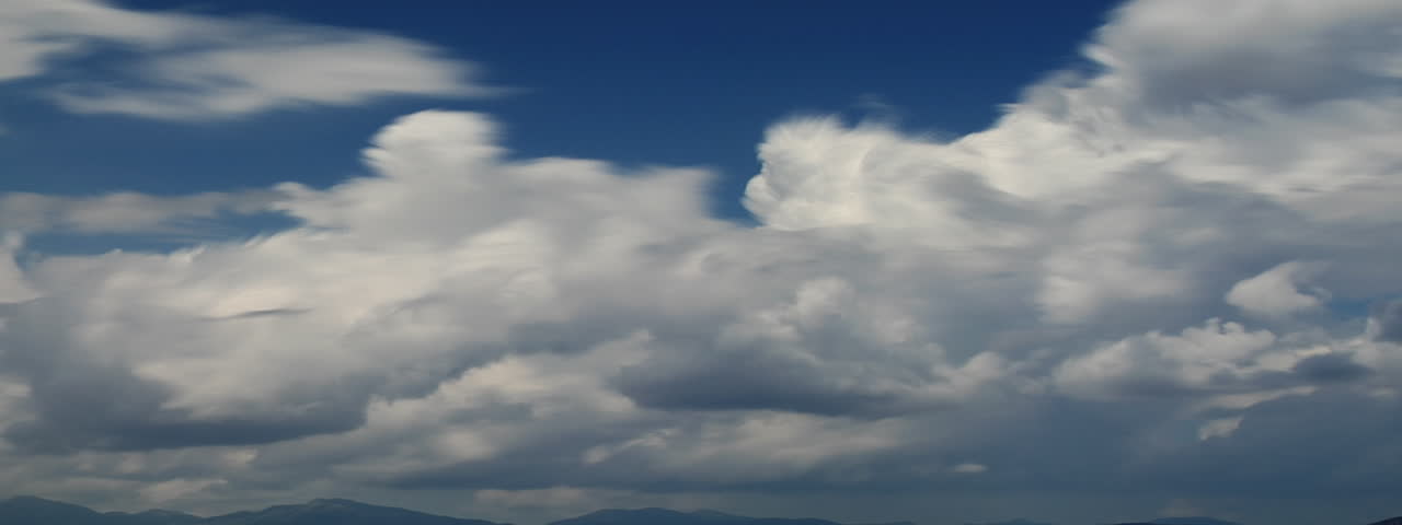 A beautiful time lapse of clouds in a blue sky.