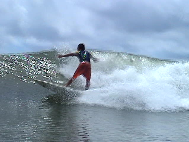 Brazilian surfer falling from his board