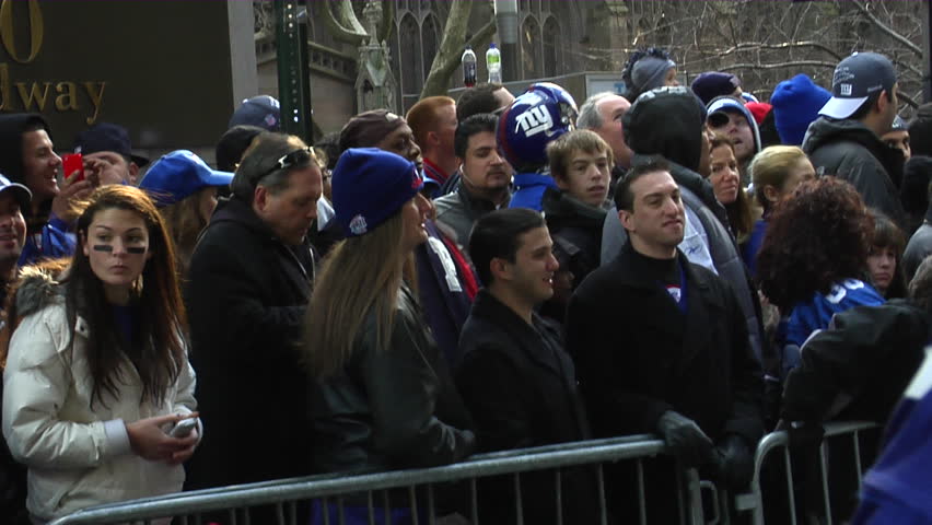 NEW YORK - FEBRUARY 7: Fans wait in anticipation of the ticker-tape parade in honor of the Super Bowl XLVI Champions New York Giants on Tuesday, February 7th, 2012 in New York. 