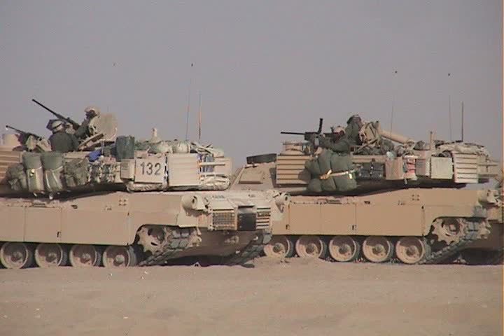 IRAQ - CIRCA 4/24/03: M1 Tanks firing machine guns.