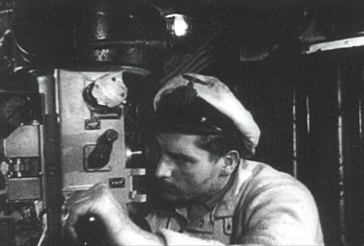 ATLANTIC OCEAN - CIRCA 1942-1944: World War II, German U-boat Captain Watching US Navy Ship Sink Through Periscope, publisher National Broadcasting Service (U.S.)