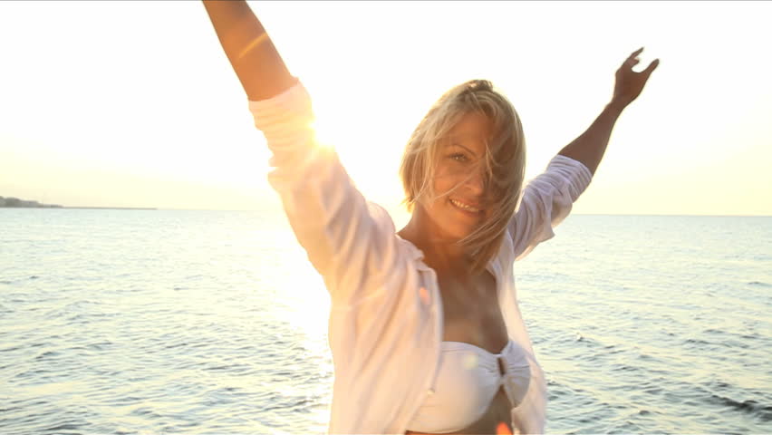female on the beach enjoying