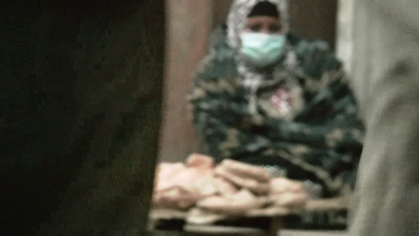 CAIRO, EGYPT - NOV 20: A woman tries to sell bread in Tahrir Square on November 20, 2011 in Cairo Egypt.