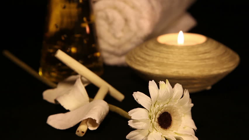 Essential Oil Bottles, towels, candle and flower for healthy spa treatment, shoot Canon 5D Mark II