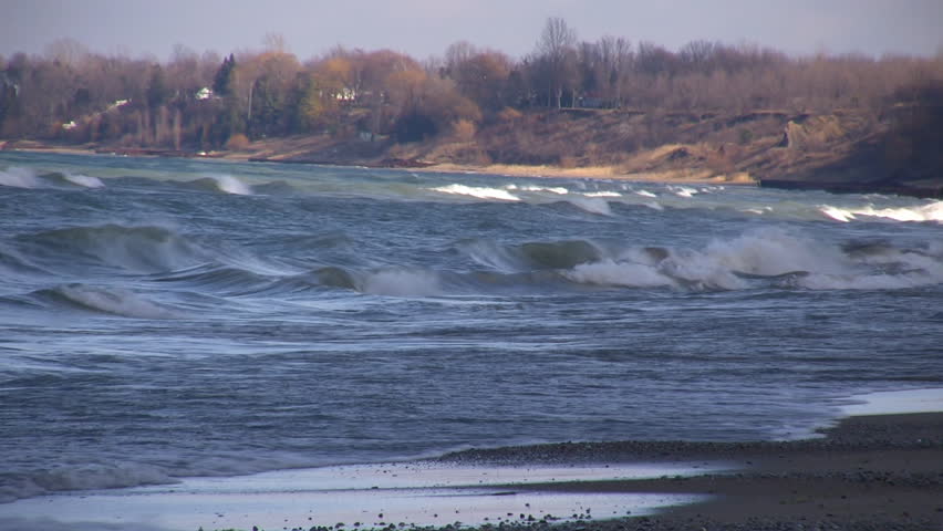 Waves continuously crash all along the beach for miles up the coasttline.  (High Definition)