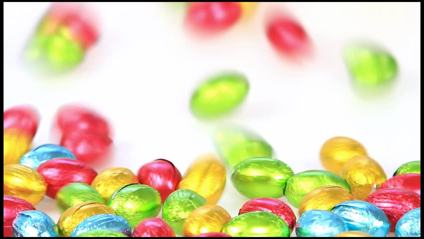 Falling colorful shiny chocolate eggs