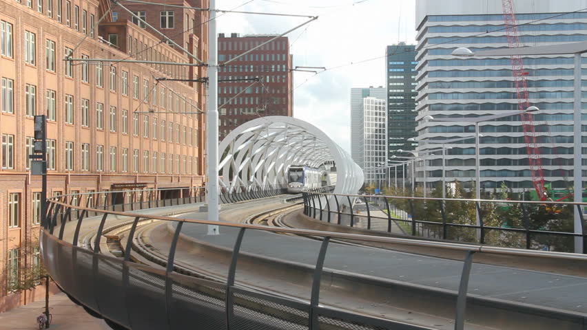 Tram drives on an elevated platform in The Hague, Holland.