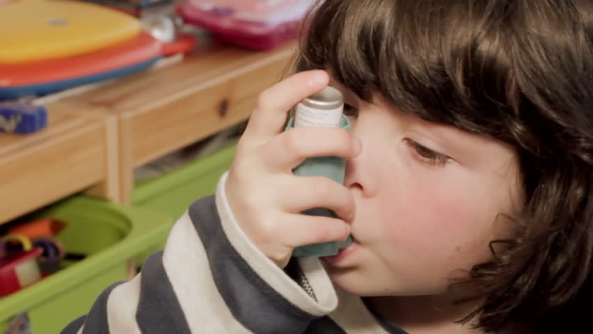 Girl with asthma inhaler