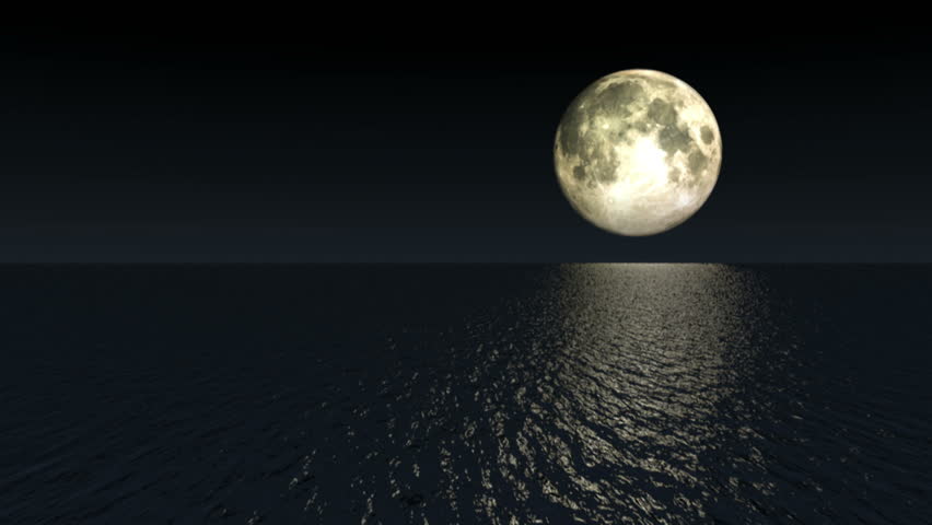 Moon over shimmering water at night.