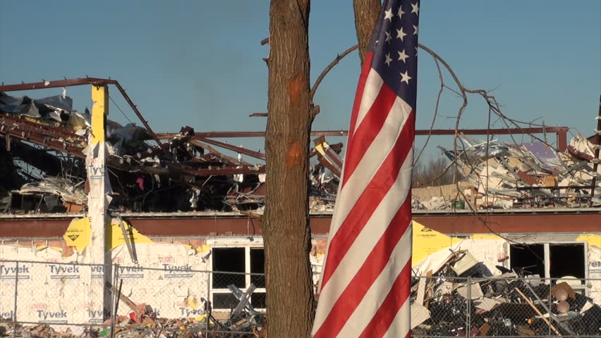 HENRYVILLE, IN - USA, MARCH 10, 2012- An American flag flies over the rubble in Henryville, IN, nearly a week after an EF-4 tornado struck the community on March 2, 2012. 