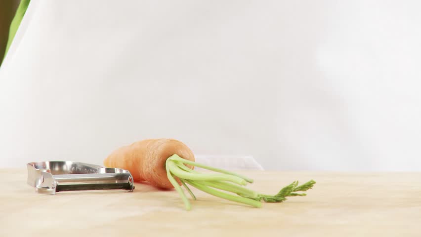 A carrot being peeled