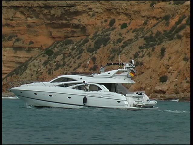 Motor yacht leaving harbor, clip 9