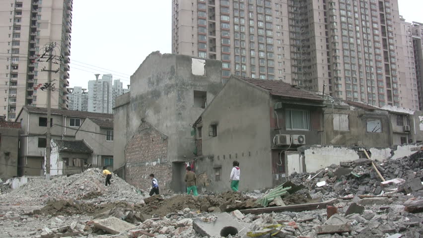 SHANGHAI - JUNE 2: Children are playing amidst a demolished quarter in Shanghai, China on June 2, 2010.