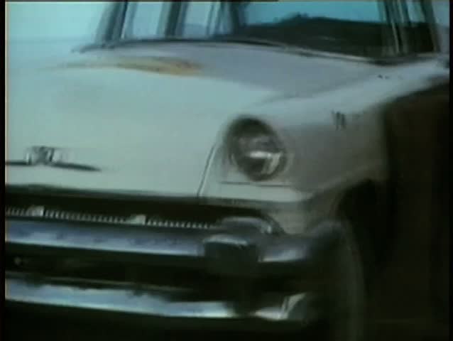 1970s car falling down slope and smashing