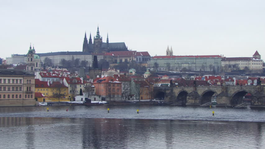 WIDE SHOT, Time lapse, Boats on river near Old Town Bridge in Prague, Czech Republic