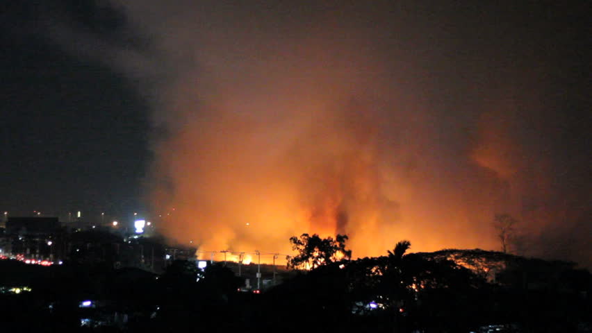 Wild fires burn out of control in a grassy field on the outskirts of Bangkok, Thailand.