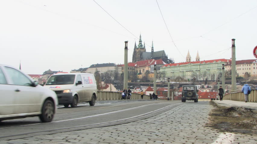 WIDE SHOT Tram over bridge Prague, Czech Republic