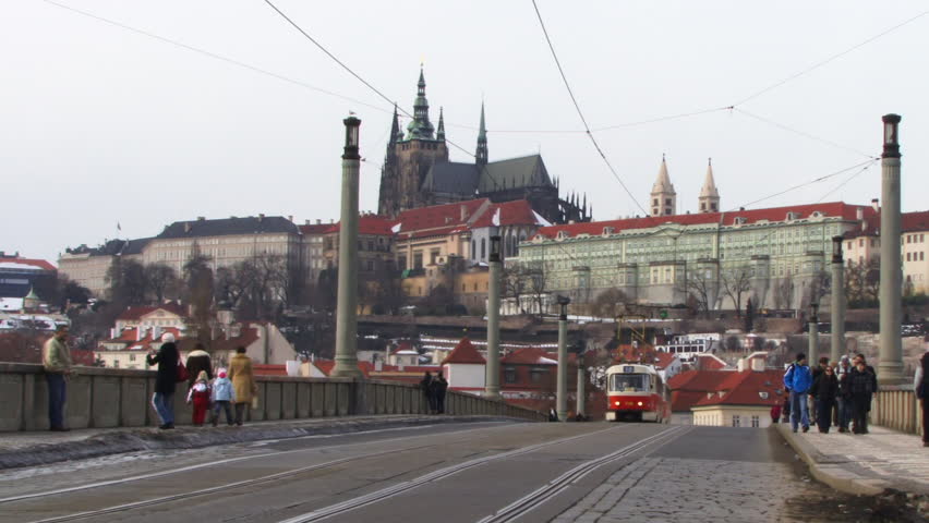 WIDE SHOT, Tram over bridge with St Vitus's Cathedral Prague, Czech Republic