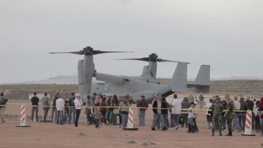 ST GEORGE, UTAH - MAR 17: Spectators watching US Military V-22 Osprey vertical takeoff and landing special operations aircraft with crowds on March 17, 2012 in St George, Utah.