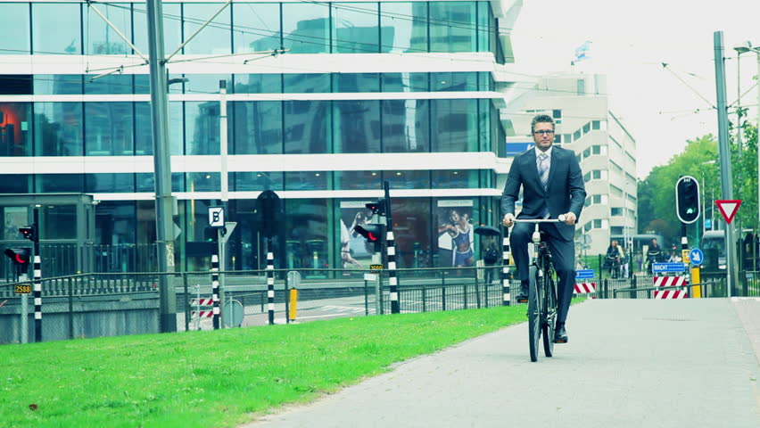 Business male cycling to office
