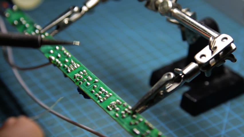 repairman with soldering iron 2/2
