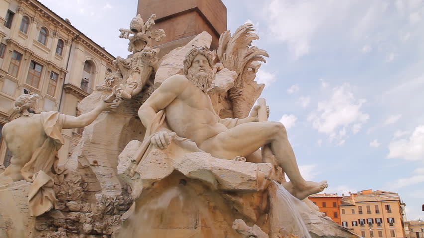 Four Rivers Fountain Rome Pan Left (HD). Four Rivers fountain in Piazza Navona in Rome Italy. All faces carefully blurred out so they are unrecognizable in people. 