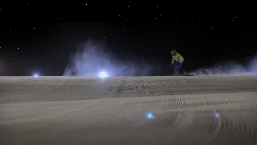 HD super slow motion. Snowboarding in night.