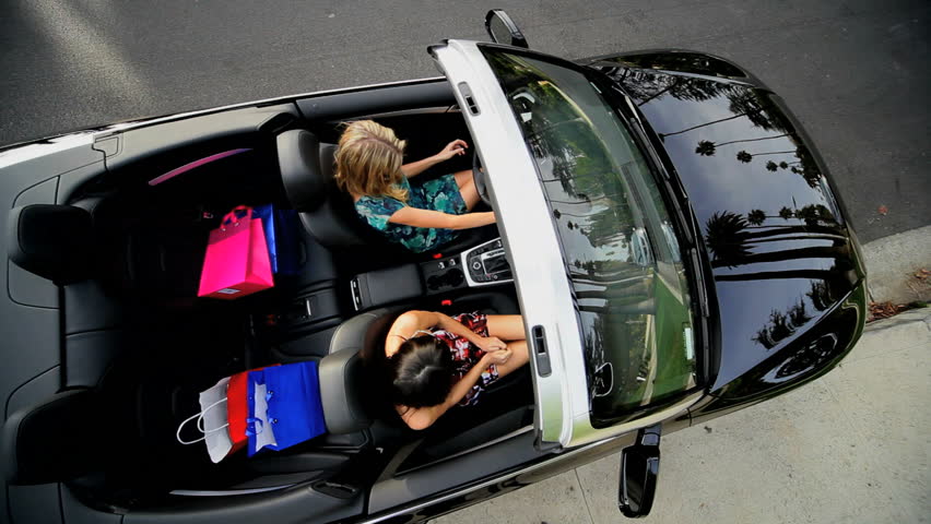  Fun lifestyle in a luxury car after a successful shopping trip 