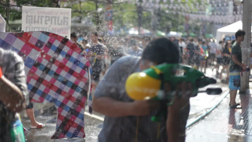 BANGKOK - APRIL 14, 2012: Thai people are celebrating Songkran Water Festival at Siam Square in Bangkok on April 15, 2012. 