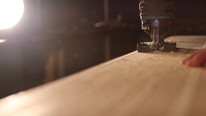 Workman in joinery workshop.