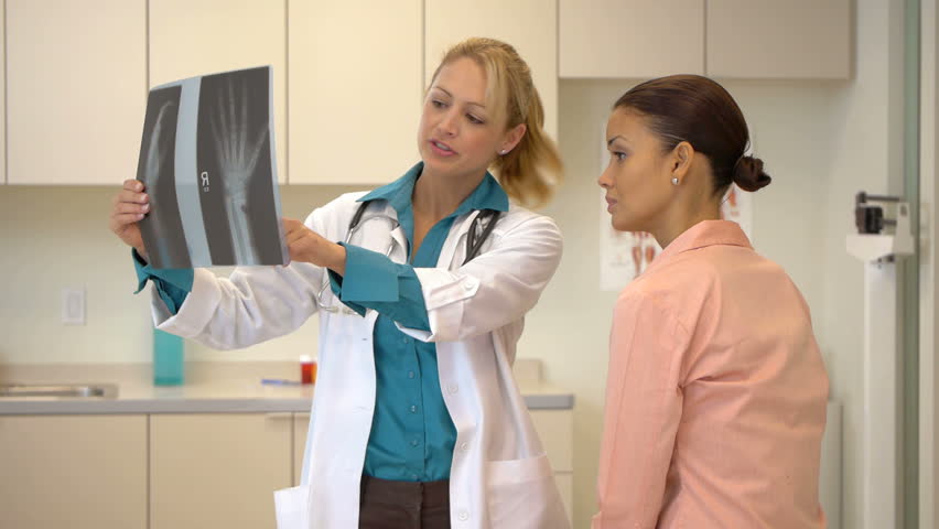 Female doctor talking with patient