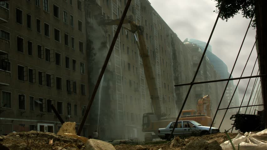 Timelapse of crane demolishing building in Beijing, China.