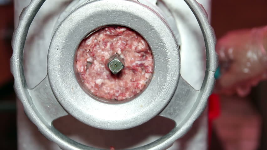 Freshly ground meat in commercial kitchen meat grinder machine. HD1080p. 