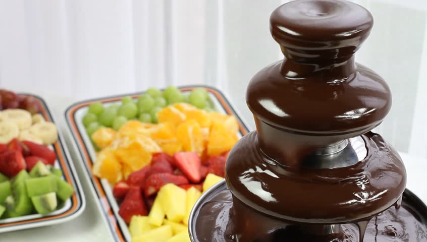 Flowing chocolate in chocolate fountain