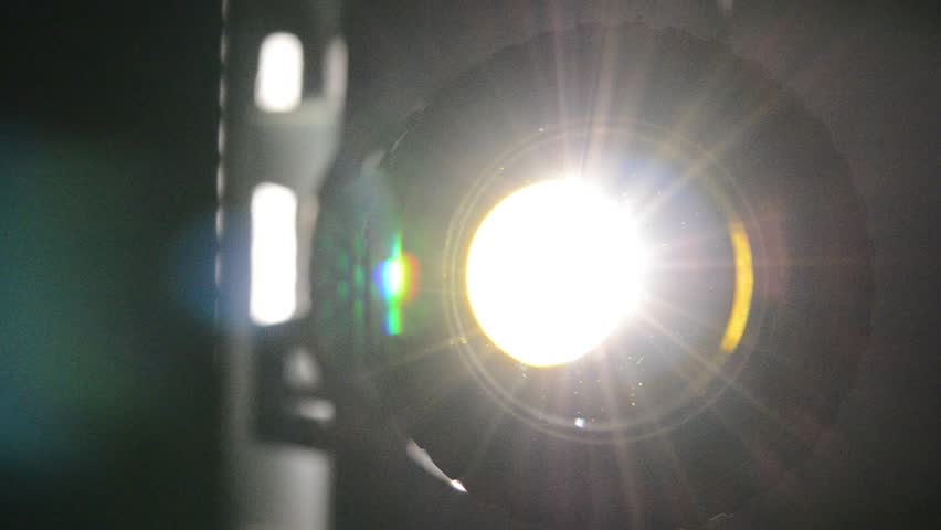 Film projector close up, projector lens and light