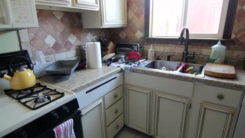 Man Cleans Kitchen