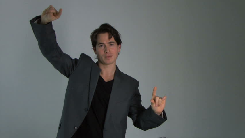 Business male moving virtual graphs, static shot, medium wide shot