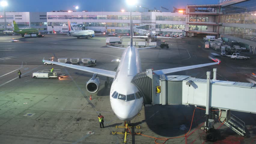 MOSCOW - MAR 7: (Timelapse View) Plane stands in territory of Domodedovo airport in evening, on March 7, 2012 in Moscow, Russia