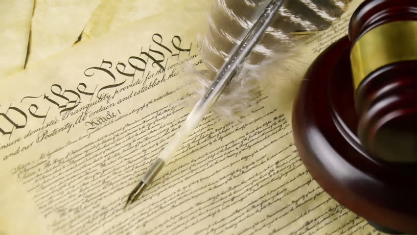 US Constitution Left Pan (HD). US constitution parchment with judge gavel and feather quill shown with a slow left pan movement. 