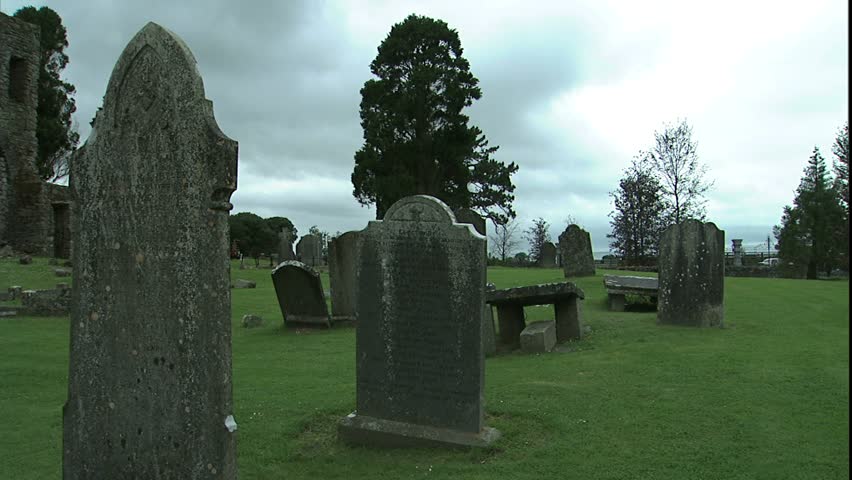 Pan ruins in Irish National Stud Park, panning across grave stones