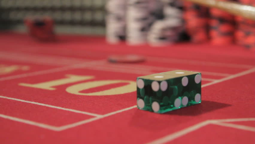 Dice hook being used at a crap table