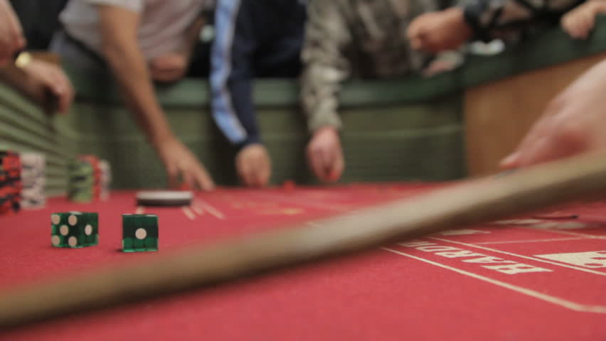 View of gamblers placing their bets on a crap table