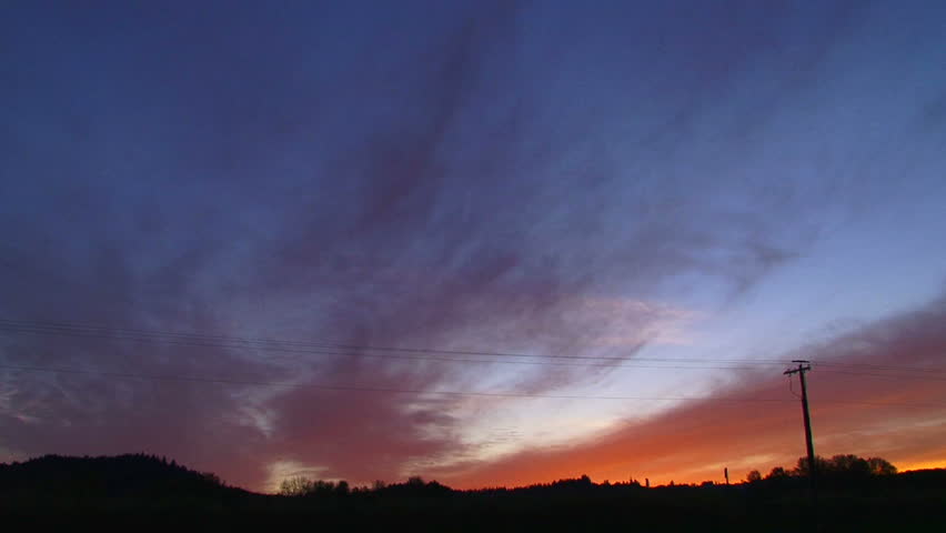 Time lapse during sunset with vivid clouds from day to night.