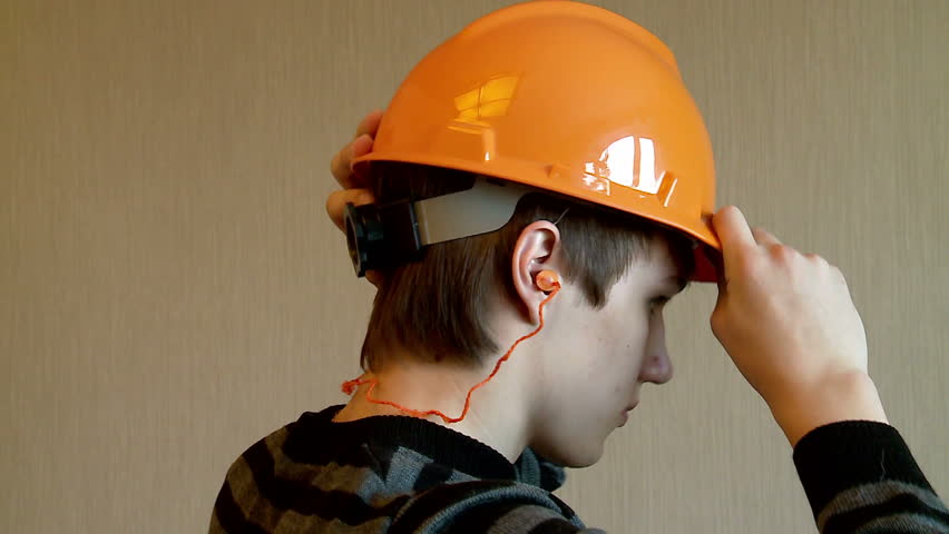 Worker is wearing PPE (Personal protective equipment).