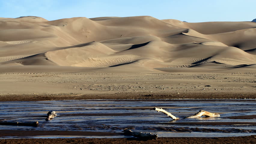 Great Sand Dunes National Park in Colorado, with Medano Creek running at the base of the dunes.  HD 1080p time lapse.