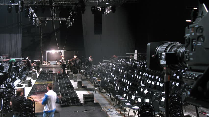 MOSCOW - APR 8: (Timelapse View) Men disassemble chairs after mannequin parade on VOLVO - Week of fashion in Moscow in Gostini dvor, on April 8, 2012 in Moscow, Russia
