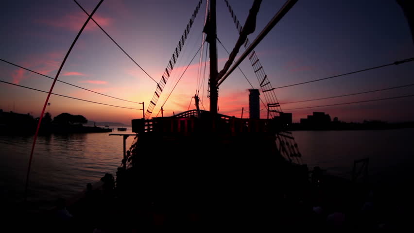 aboard an old wooden pirate ship out at sea