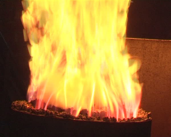 pellets burning open flame in barrel. green fuel for heating homes.