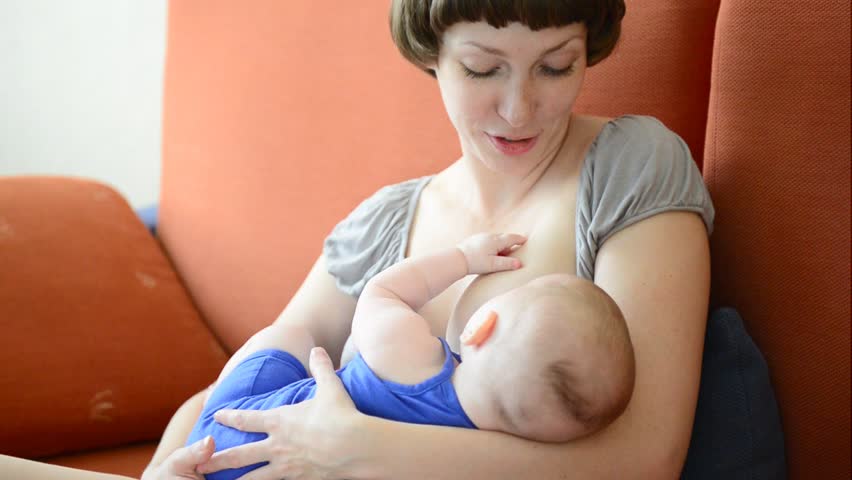 Mother breastfeeding her baby girl