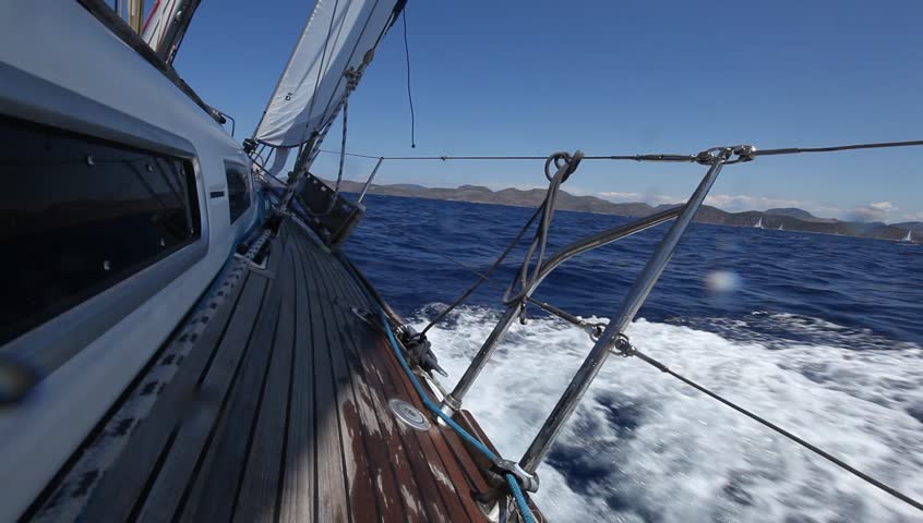 Sailing in the wind through the waves (HD) Sailing boat shot in full HD at the Mediteranean sea.